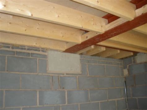 Steel Beam Supporting Floor Joists Bearing Onto A Padstone Steel