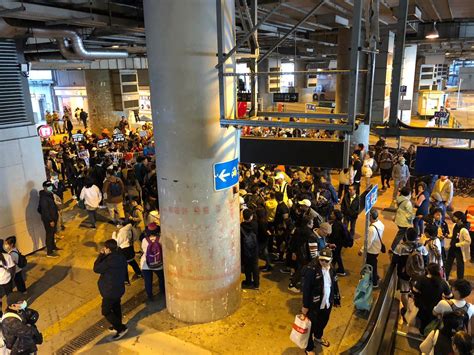 Over a hundred protesters march from main bus terminus at Yuen Long MTR ...