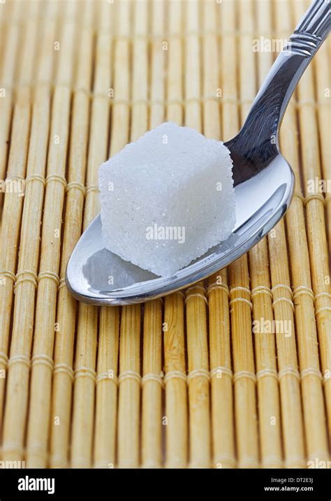 A Spoonful Of Sugar Cubes Stock Photo Alamy