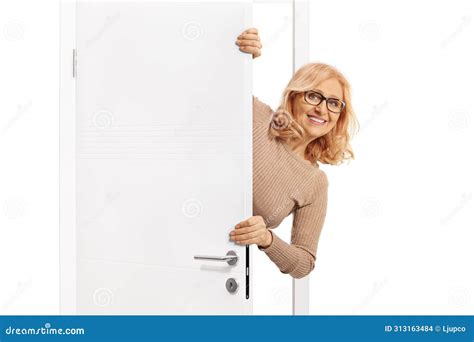 Smiling Mature Woman Behind A Door Stock Photo Image Of Looking