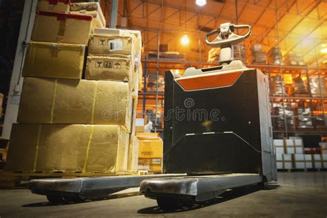 Electric Forklift Pallet Jack With Package Boxes Stacked On Pallets