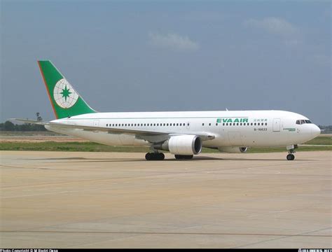 An Airplane Is Sitting On The Runway Waiting To Take Off