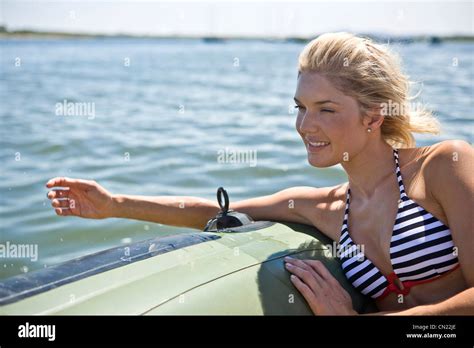 Young Woman Relaxing In Dinghy Stock Photo Alamy