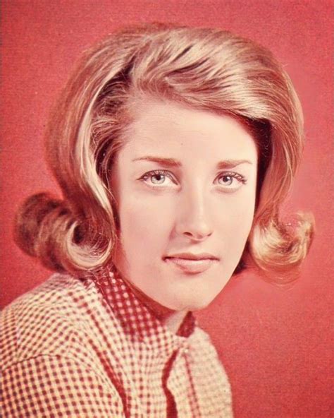 An Old Photo Of A Woman With Blonde Hair Wearing A Plaid Shirt And Neck Tie