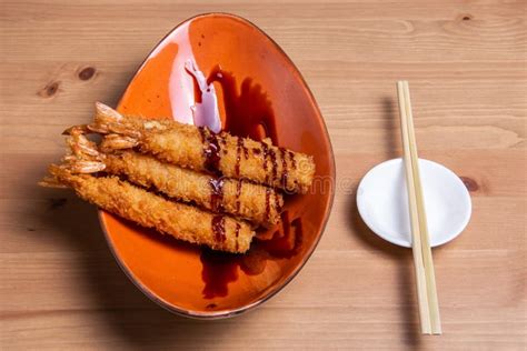 Tempura Deep Fried Shrimp Ebi With Sweet Chili And Soy Sauce On Black