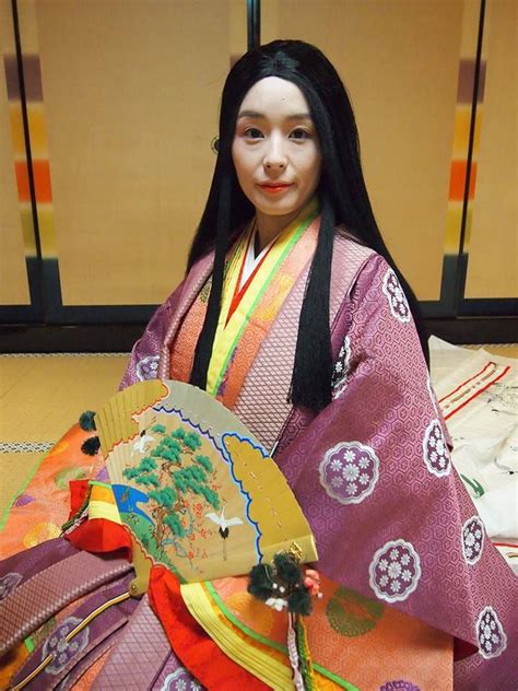 A Woman Dressed In Junihitoe At A Junihitoe Photography Experience