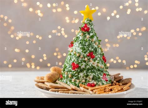Christmas Tree Cheese Ball Appetizer With Bread Crackers And Decorated