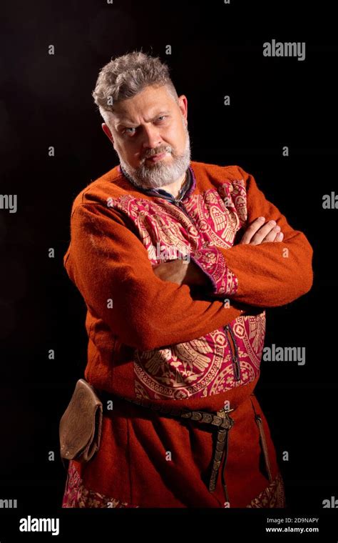 Mature Bearded Man In Traditional Historic Clothes Studio Portrait