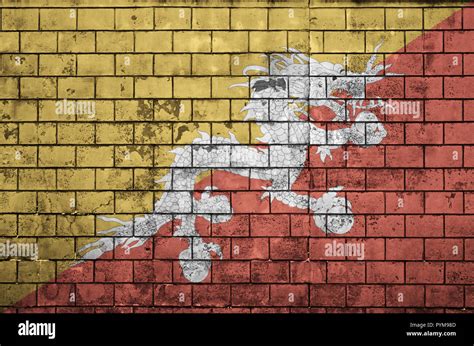 Bhutan Flag Is Painted Onto An Old Brick Wall Stock Photo Alamy