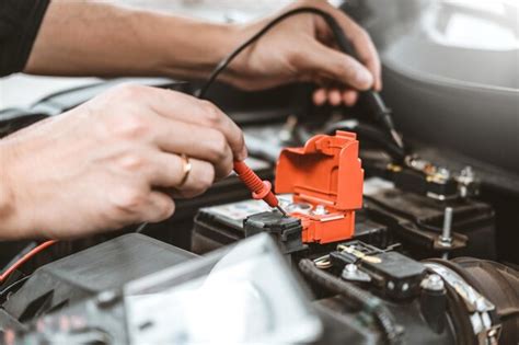 Premium Photo Cropped Hands Of Mechanic Repairing Car Engine