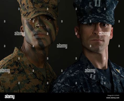 U.S. Marine Corps Officer in MARPAT digital camouflage uniform and camo face paint with Naval ...