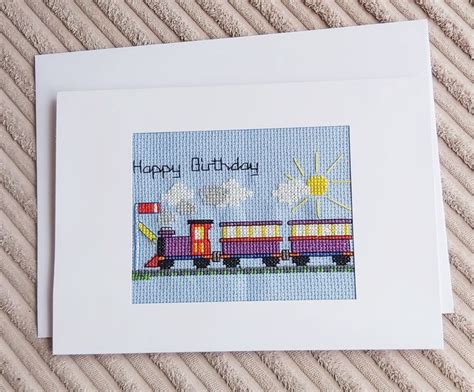 A Cross Stitch Birthday Card With A Train