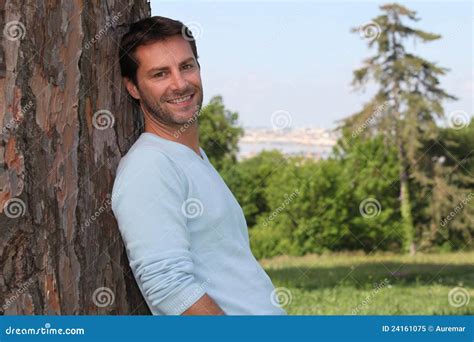 Man Leaning Against A Tree Royalty Free Stock Photo Image 24161075