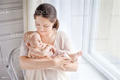 Portrait Of Happy Mother And Baby At Home Stock Photo Download Image