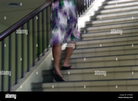 Woman Going Up Stairs Stock Photo Alamy