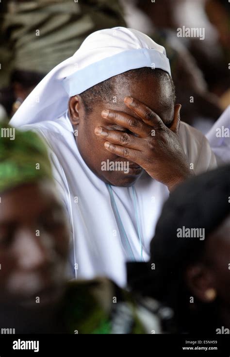 Roman Catholic Nun Sister Praying During Sunday Service In A Catholic