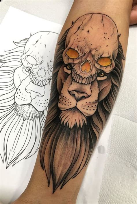 A Man S Arm With A Lion Tattoo On It And A Skull In The Middle