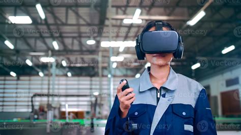Engineer is using virtual reality glasses to inspect the factory's