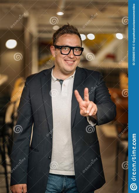 Smiling Young Businessman In Glasses Look In Camera Distance Thinking