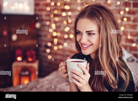 Attractive Woman Drinking Hot Tea Stock Photo Alamy