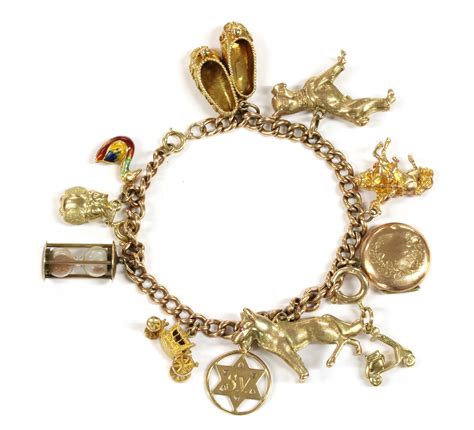 Lot 48 A 9ct Gold Charm Bracelet