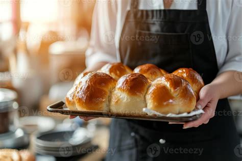 AI Generated Baker Presents A Tray Of Hot Fresh Buns Generative AI Stock Photo At Vecteezy