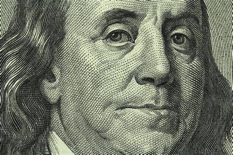 portrait of Benjamin Franklin on the hundred dollar bill closeup