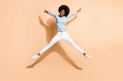 Curly Funny African American Girl Dancing And Singing With Hair Dryer