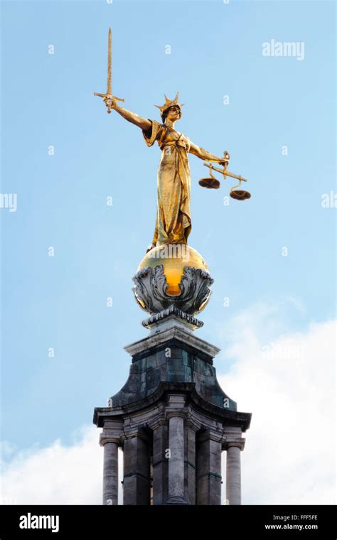 The Golden Statue Of Lady Justice On Top Of The Dome Of The Central