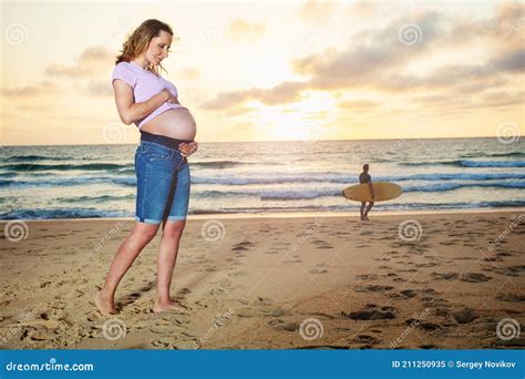 Pregnant Woman On The Sunset Beach Pose Near Ocean Stock Image Image Of Light Belly 211250935