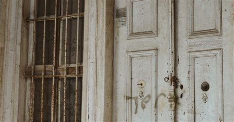 An Old White Wooden Door Of A House · Free Stock Photo