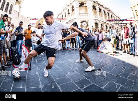 Playing Street Football On Souq Waqif Traditional Market During The