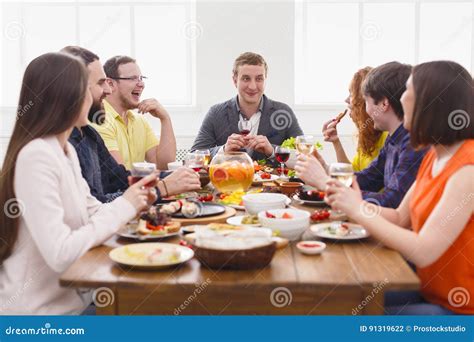 Group of Happy People at Festive Table Dinner Party Stock Photo - Image