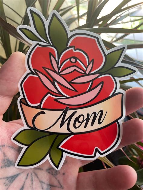 A Sticker That Says Mom With A Rose On It