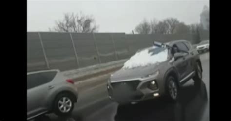 Video Shows Driver Clearing Snow Off Windshield While Driving On Highway