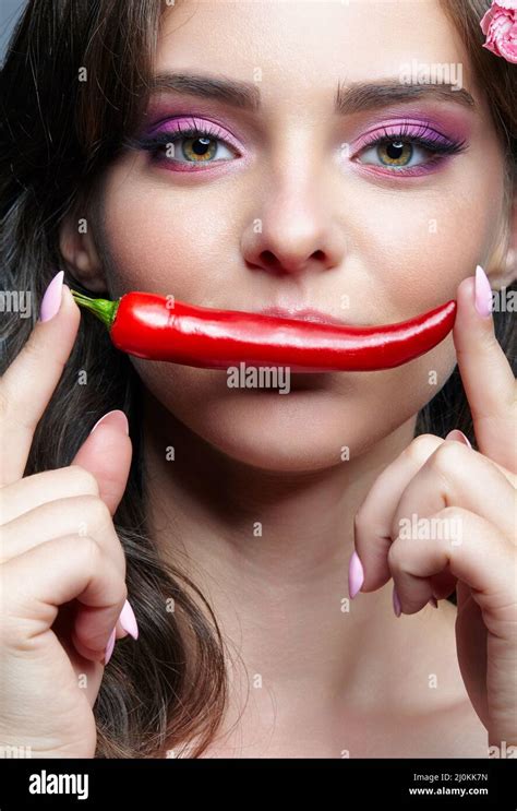 Female With Spicy Hot Red Cayenne Chilli Pepper Stock Photo Alamy
