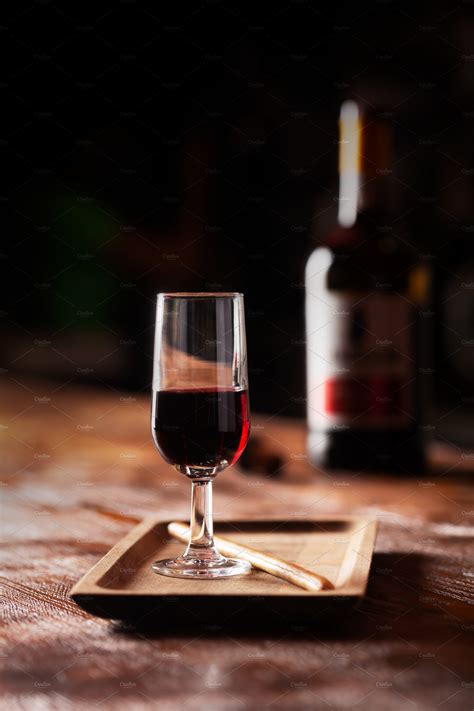 Glass of port wine on wooden table a ~ Food & Drink Photos ~ Creative ...