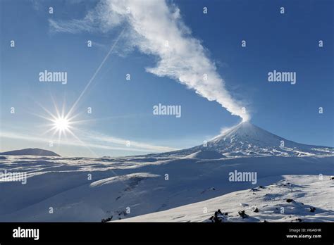 Kamchatka Peninsula Winter Eruption Active Klyuchevskoy Volcano Klyuchevskaya Sopka And Sun