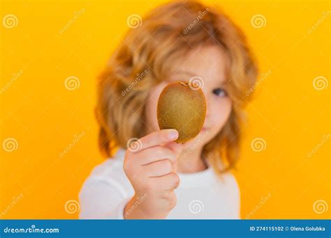 Child Hold Kiwi In Studio Kiwi Fruit Studio Portrait Of Cute Kid Boy