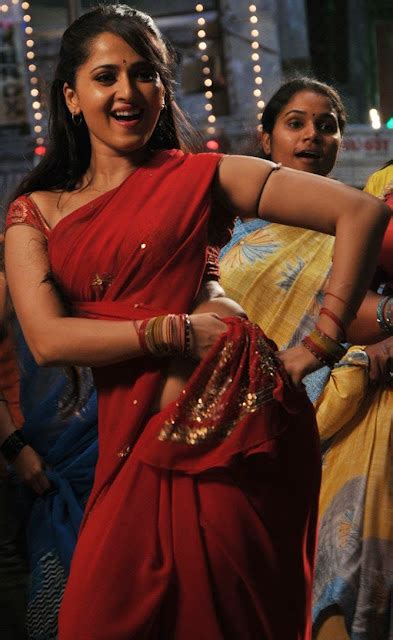 The Celebrities Hot Action Anushka In Red Saree Nevel Show Photos Gallery