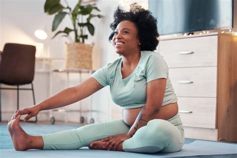 Yoga Pregnant And Black Woman Stretching Legs In Home For Flexibility