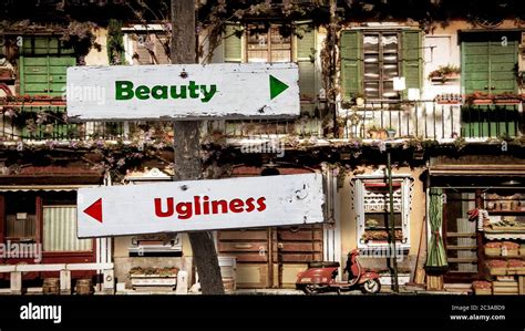 Street Sign Beauty versus Ugliness Stock Photo - Alamy