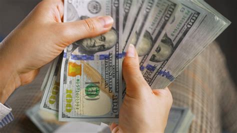 Woman Counting Us Dollar Bills Or Paying In Cash Stock Video