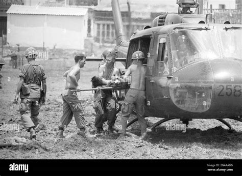 A Trooper Of The Us 9th Infantry Division Is Loaded Into A Helicopter In The Southern Part Of