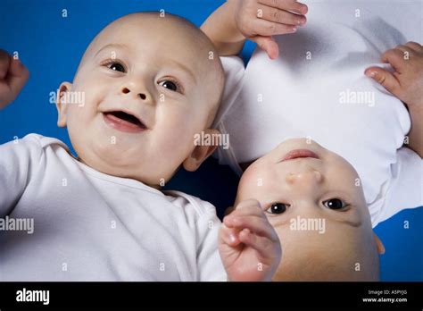 Twin Babies Looking Up Stock Photo Alamy