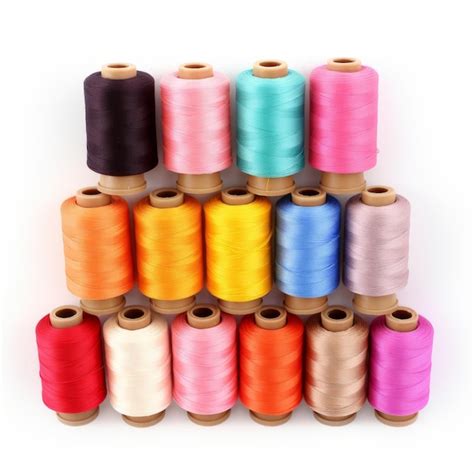 Premium Photo Colorful Thread Spools And Sewing Accessories