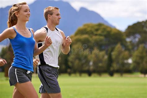 Man Woman And Running For Exercise On Field With Smile For Speed