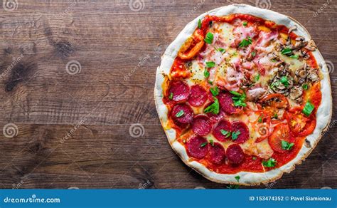 Pizza `four Seasons` With Mozzarella Cheese Ham Tomato Sauce Salami