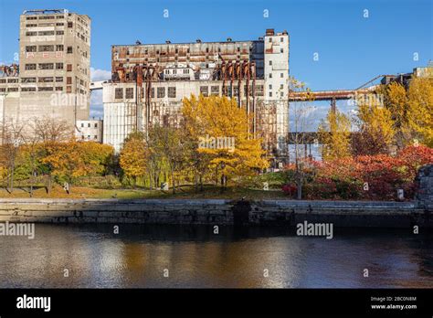 OLD FLOUR MILLS IN AUTUMN COLORS MONTREAL QUEBEC CANADA Stock Photo