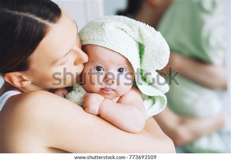 Mom Hugs Her Little Cutest Baby After Bath With Towel On Head Child